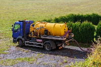 A cesspit tank emptying its content