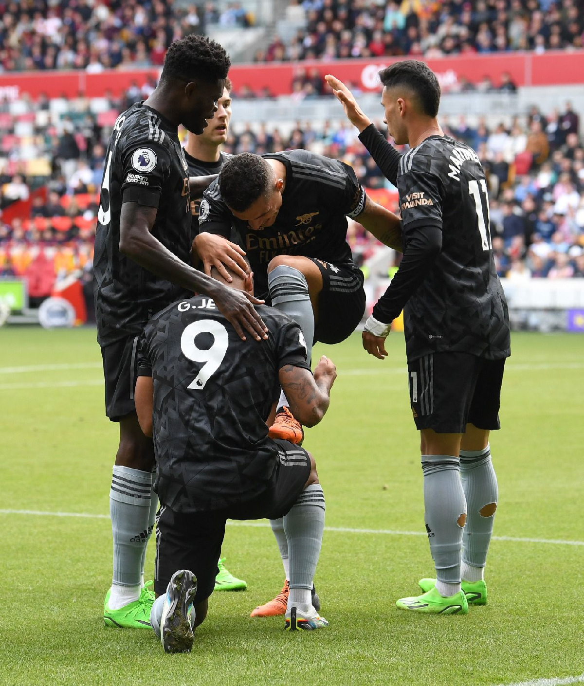 Partey (left) joins in a goal celebration