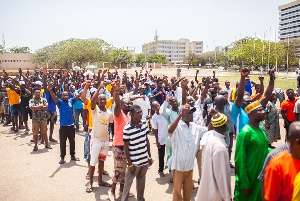 File photo: A group of people queuing for food