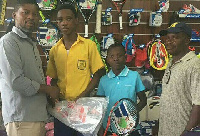 Aaron Asante and Michael Dosoo receiving the Tennis equipments