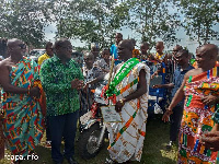 Deputy Eastern Regional Minister, Mr Samuel Nuertey Ayertey with the farmers in the region