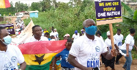 The members of the Church displaying placards with inscriptions