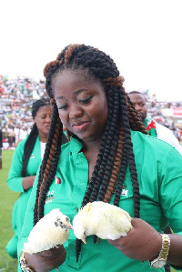 NDC lady holding on to the doves ahead of their release