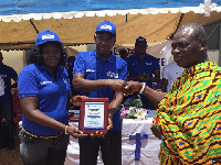 A traditional leader receiving the 'Open Defecation Free' certificate on behalf of his community