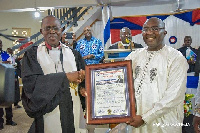 Vice President, Dr Mahamudu Bawumia recieving his citation from the pastor