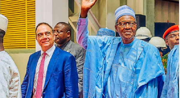 Flour Mills of Nigeria Chairman John Coumantaros [left] and President Muhammadu Buhari. Photo: FMN