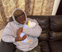 Ghanaian rapper, Medikal with daughter, Island Frimpong