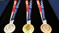 Trophy and medals are part of the winning package