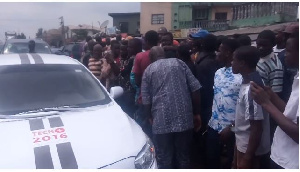 The self-driving car was mobbed by people who were excited seeing the car for the first time