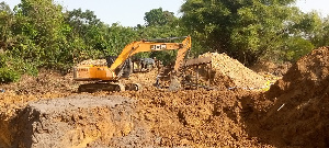 An excavator on the site of the illegal mining