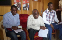 Paul Akoh [Middle], addressing the press at NPP Regional Headquarters at Sunyani.