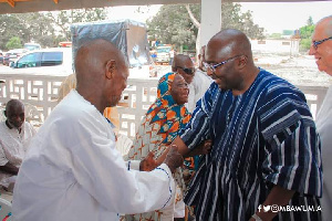 Fr Campbell and Dr Bawumia interacting cheerfully with some lepers on World Leprosy Day