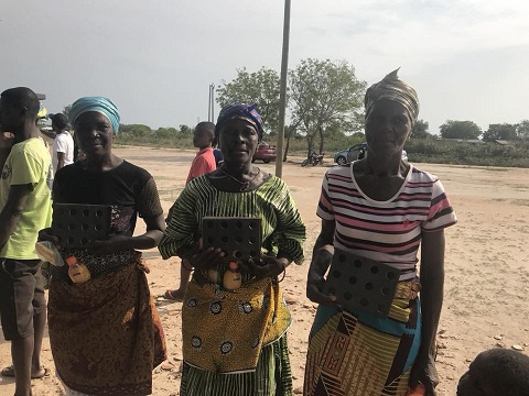 Some women of Ningo-Prampram holding their clean cook steel given to them by the foundation