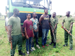 The suspects with the anti-poaching team