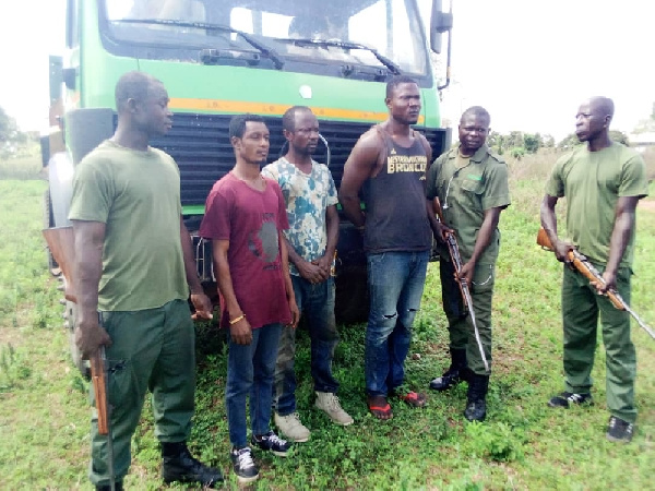 The suspects with the anti-poaching team