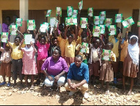 Empowerment Aid in a group photograph after the donation