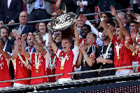 Thomas Partey with his teammates celebrating after winning the title