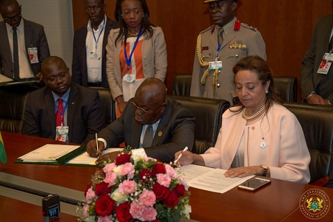 Prez Akufo-Addo signinging the treaties in the presence of the AU Commissioner for Social Services