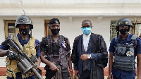 Police personnel  in a photo with a legal rep at the Supreme Court