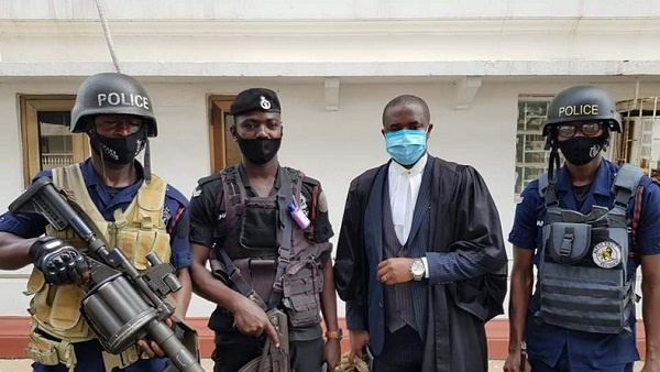 Police personnel  in a photo with a legal rep at the Supreme Court