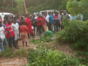 A group of people at the scene of an accident