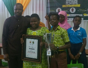 The victorious team from Akuapem North display their trophy and plaque