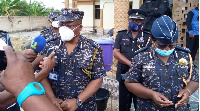 Inspector General of Police(IGP), Mr James Oppong-Buanuh with his entourage