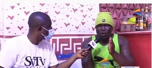 Ghanaian boxer, Bukom Banku [R] granting an interview to SVTV Africa's DJ Nyami