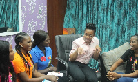 Dr. Zanetor Rawlings  in a discussion with the contestants