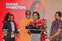 Diana Hamilton addressing the gathering after receiving an award from Seidu Iddrisu