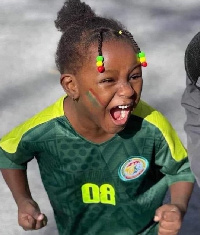 A kid in Senegal celebrating the victory of the Teranga Lions