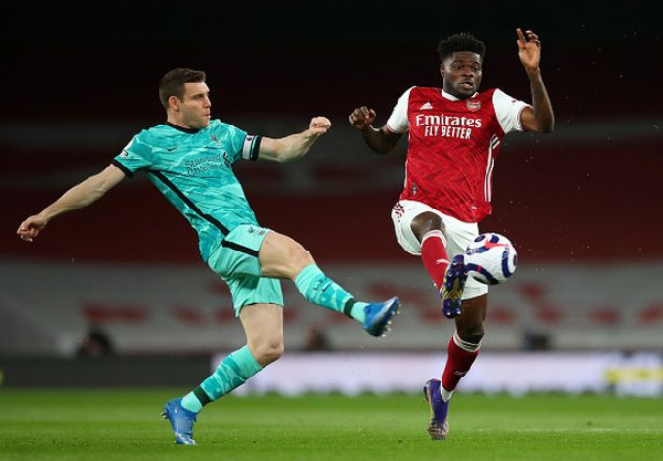 Thomas Partey [R] in action against Liverpool