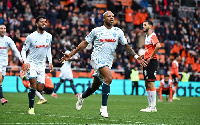 Andre Ayew celebrating with his teammates after scoring