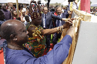 Prof. Gyan Baffuor cutting the ribbon for the project