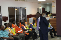 Chief Executive of the DVLA, Kwasi Agyeman Busia interacts with staff of the authority.