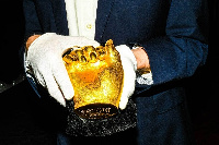 An auction employee holds one of the hands in New York