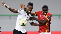 Uganda's forward Muhammad Shaban (right) challenges Ghana's defender John Boye(L)