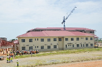 The completed Adminitration Block at the project site. Inset, some of the bloks near completion