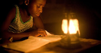 File photo - A child uses lantern in the absence on light