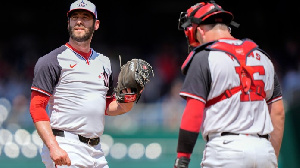 Wood looked up and down, his gaze darting from the ball to Lipscomb