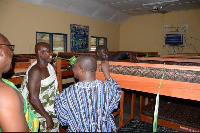 Members of the Traditional Council inspecting the beds and mattresses