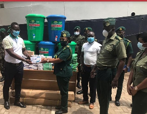 ma Regional Commander of the Ghana Immigration Service ACI Adwoa Sika Anim  receiving items