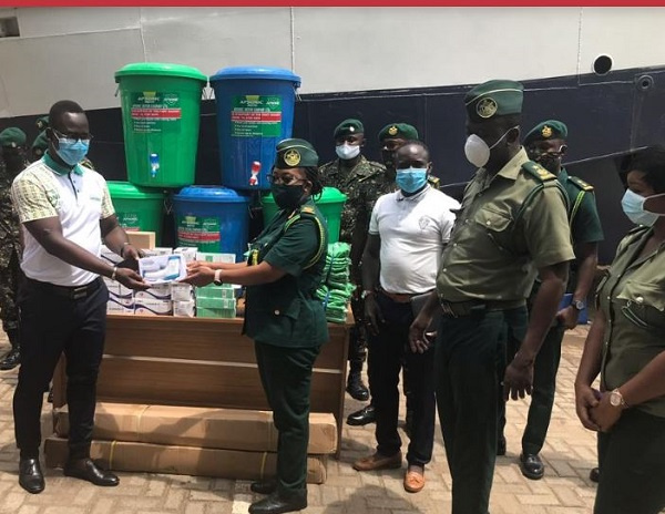 ma Regional Commander of the Ghana Immigration Service ACI Adwoa Sika Anim  receiving items