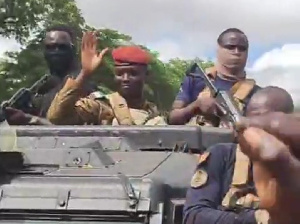 Captain Ibrahim Traore waves at a crowd as he drove around Ouagadougou