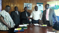 Dr. Joseph Manboah-Rockson (in white) in handshake with CEO of TAB-Forest Mines Limited