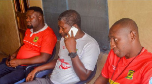 Maxwell Konadu (middle) at the residence of injured Kotoko fan Augustine Opoku