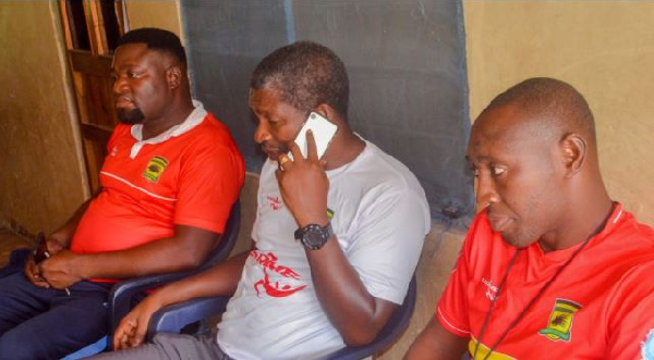 Maxwell Konadu (middle) at the residence of injured Kotoko fan Augustine Opoku