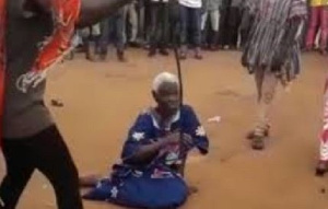 The late Denteh Akua sitting on the ground