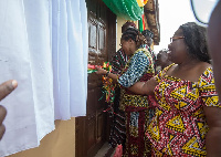 Mrs. Lordina Mahama being assisted by Nana Oye Lithur to commission the facility.