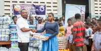 OSAFRIC official hands over items to the school